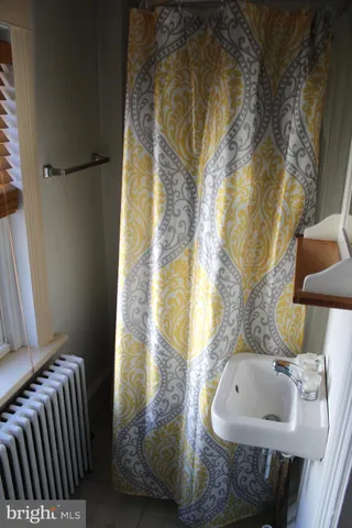 a bathroom with a tub and sink