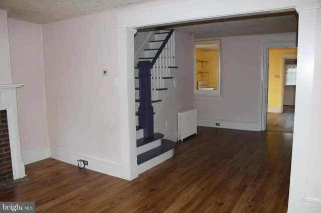 a view of an entryway with wooden floor
