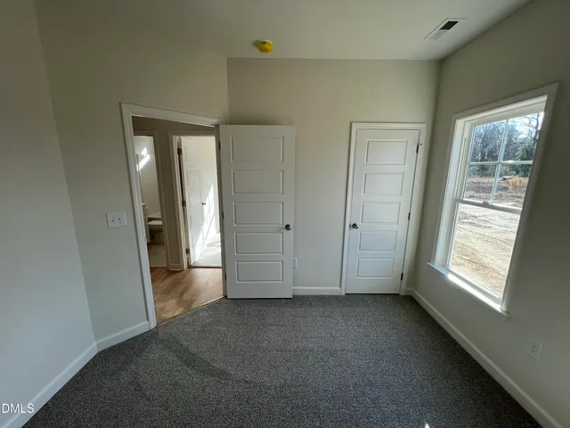 a bathroom with a sink a toilet a shower and a mirror