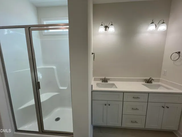 a close view of a refrigerator in the bathroom