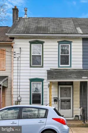 a car parked in front of a house