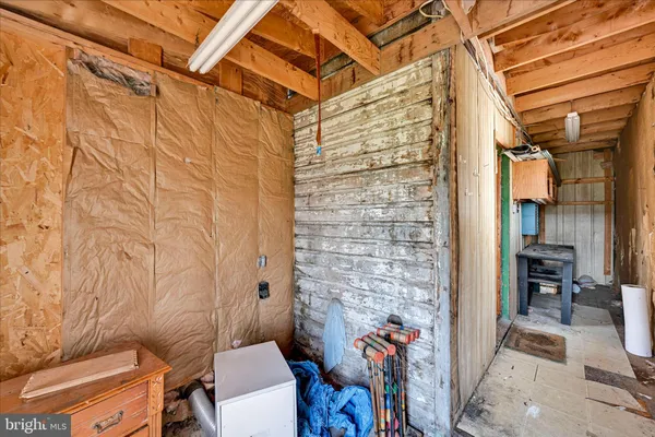a bathroom with a toilet and a shower curtain