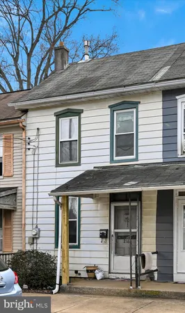 a front view of a house with garage