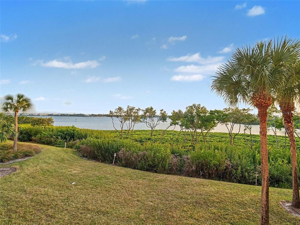 611 Riviera Dunes Way, Unit 102 Palmetto, FL 34221 - Photo 13 of 16 a view of a garden with an ocean