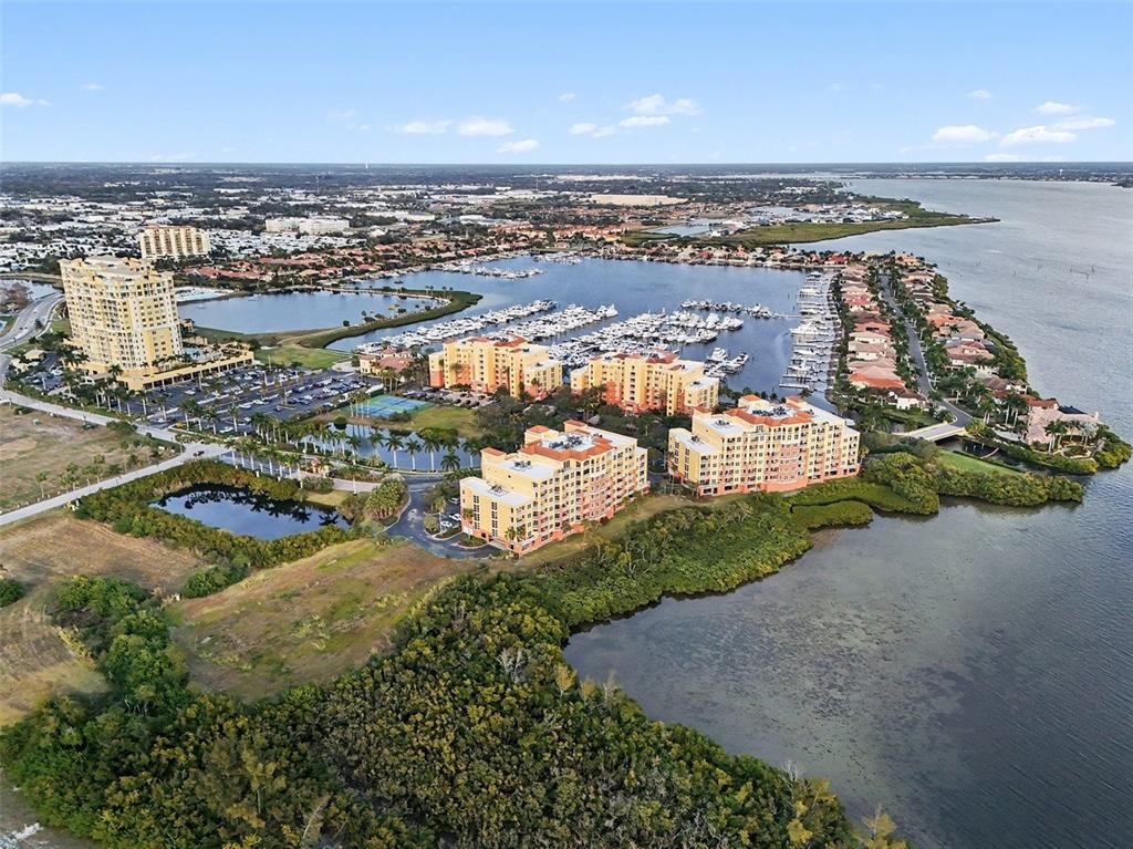 611 Riviera Dunes Way, Unit 102 Palmetto, FL 34221 - Photo 15 of 16 an aerial view of a city with ocean view