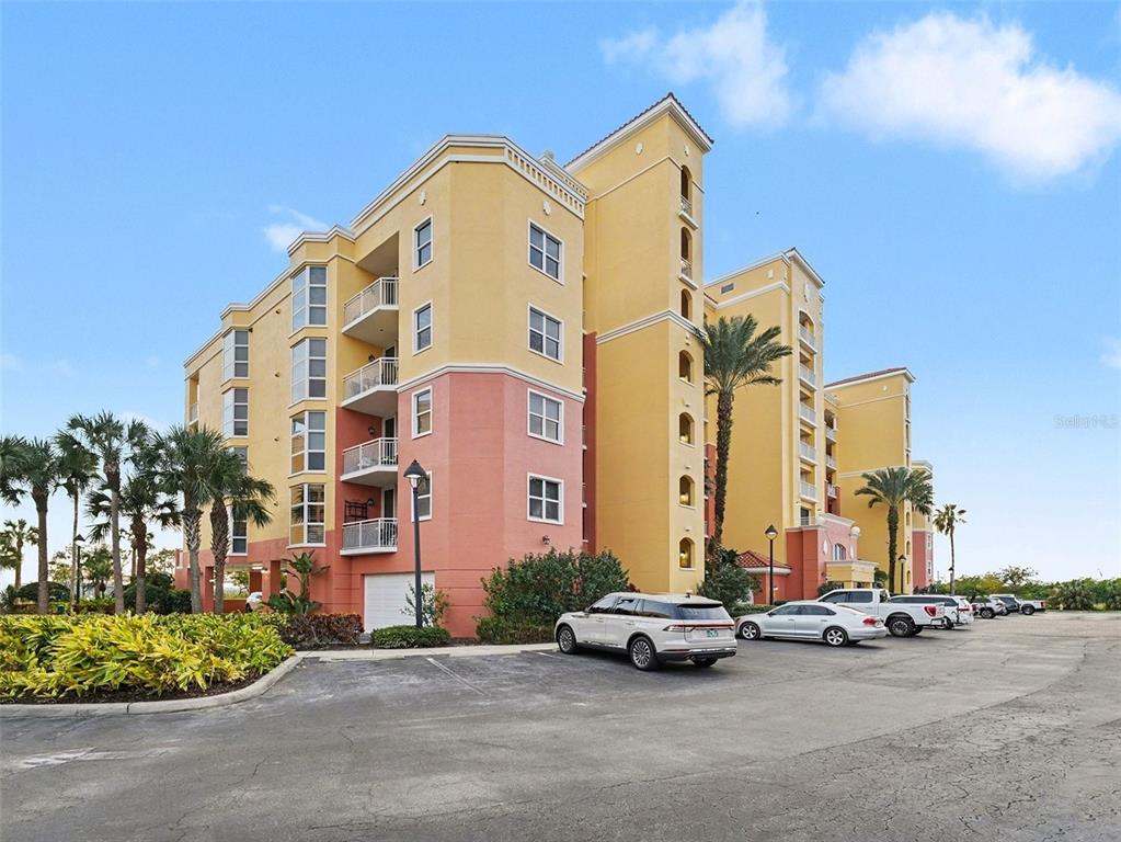 611 Riviera Dunes Way, Unit 102 Palmetto, FL 34221 - Photo 2 of 34 front view of a building with a street