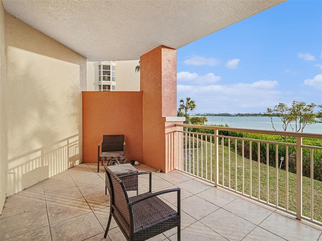 611 Riviera Dunes Way, Unit 102 Palmetto, FL 34221 - Photo 26 of 34 a view of a balcony with chair and city view