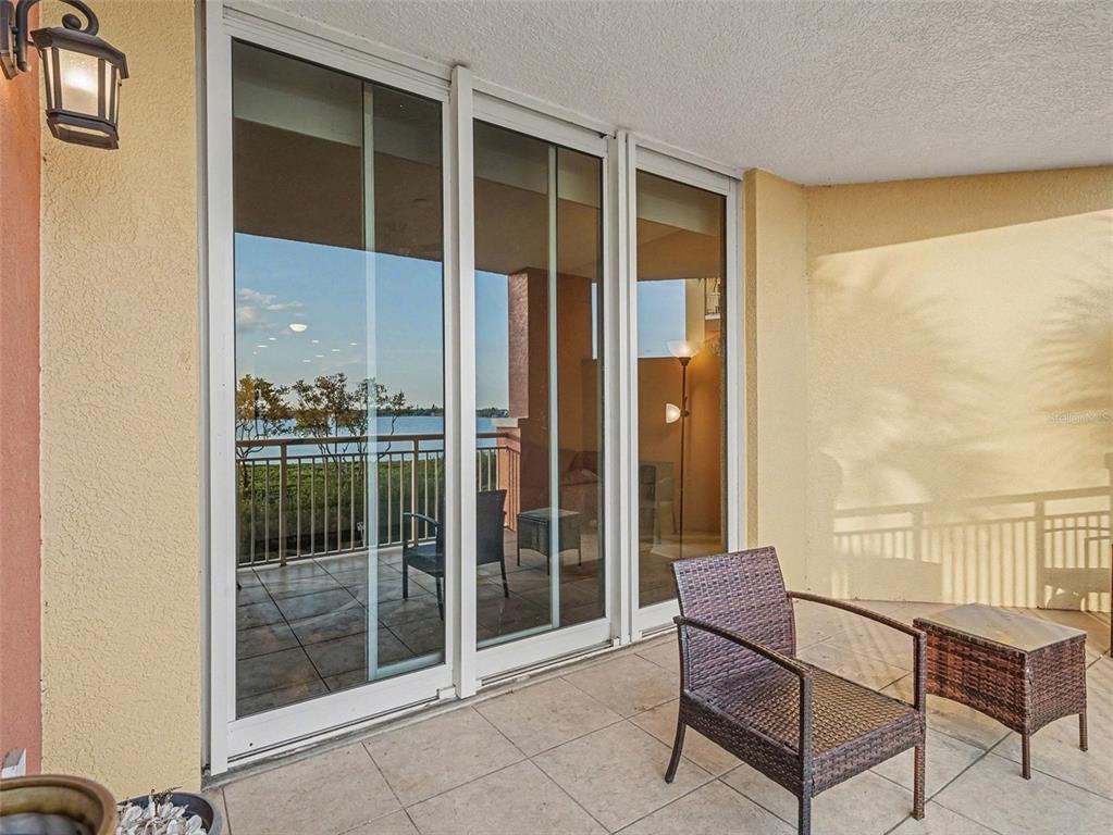 611 Riviera Dunes Way, Unit 102 Palmetto, FL 34221 - Photo 27 of 34 a view of a balcony with furniture and next to a window