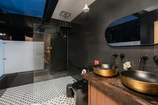 a kitchen with a sink and a stove top oven