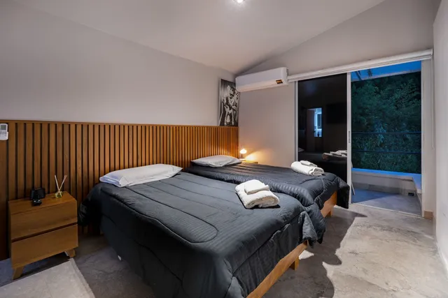 a bedroom with bed and a table