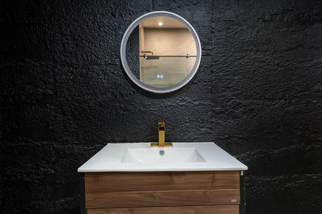 a bathroom with a sink and a mirror