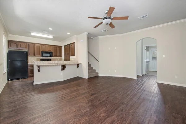 a view of kitchen with sink microwave and refrigerator