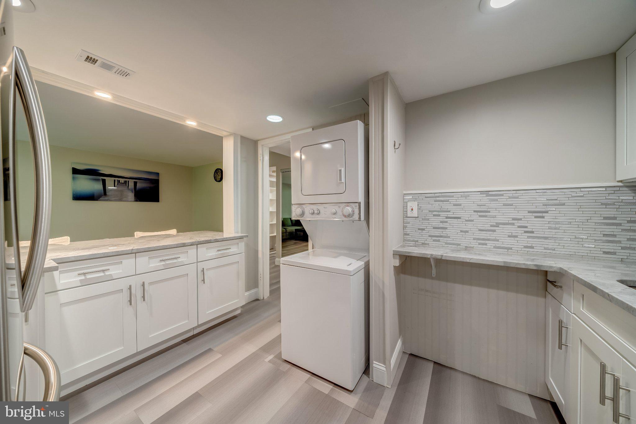 1429 Northgate Square, Unit 2A Reston, VA 20190 - Photo 16 of 25 Modern laundry space with sleek design.