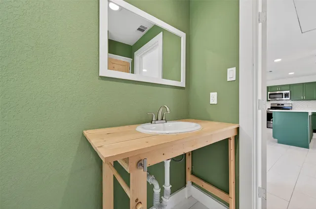 a view of a kitchen area with furniture and wooden floor