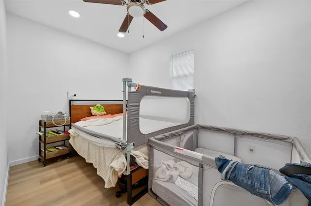 a bedroom with a bed and window