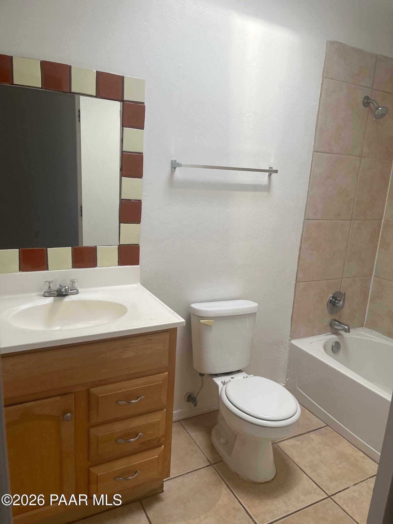 354 West Delano Street, Unit 1 Tucson, AZ 85705 - Photo 17 of 18 a bathroom with a sink a toilet and shower