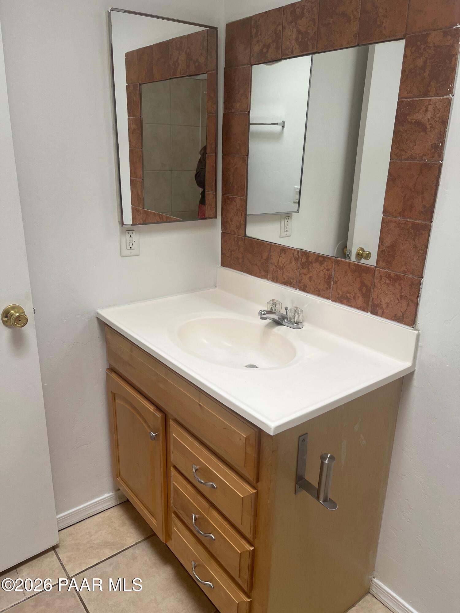 354 West Delano Street, Unit 1 Tucson, AZ 85705 - Photo 4 of 18 a bathroom with a sink and a mirror