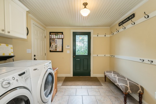 3 Glendale Road Boxford, MA 01921 - Photo 18 of 30 a view of washer and dryer with kitchen in the background
