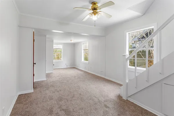 a view of an empty room with a window