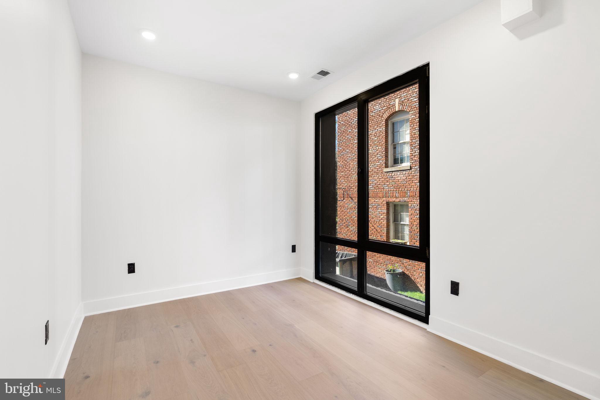 2504 41st Street Northwest, Unit 6 Washington, DC 20007 - Photo 12 of 13 a view of an empty room with a window