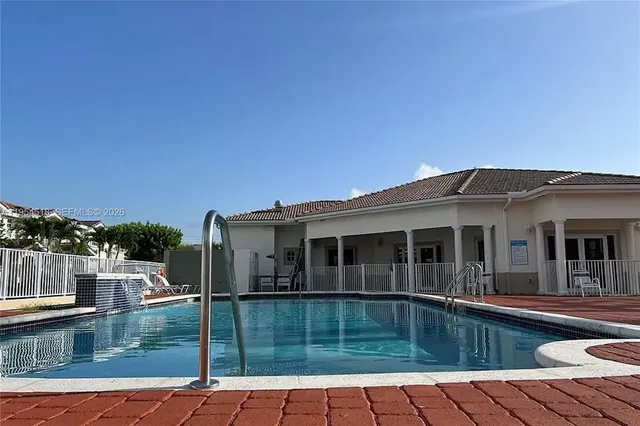a view of a house with a swimming pool