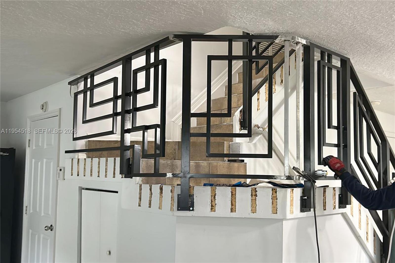 13990 Southwest 260th Street, Unit 13990 Homestead, FL 33032 - Photo 21 of 33 a view of entryway and hall with wooden floor