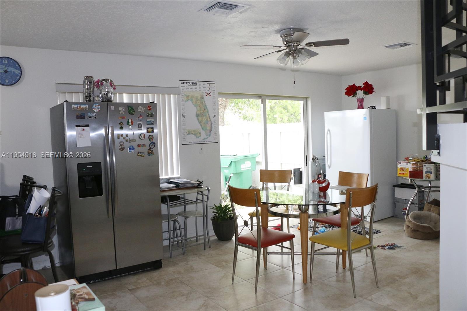 13990 Southwest 260th Street, Unit 13990 Homestead, FL 33032 - Photo 23 of 33 a view of a dining room with furniture window and outside view