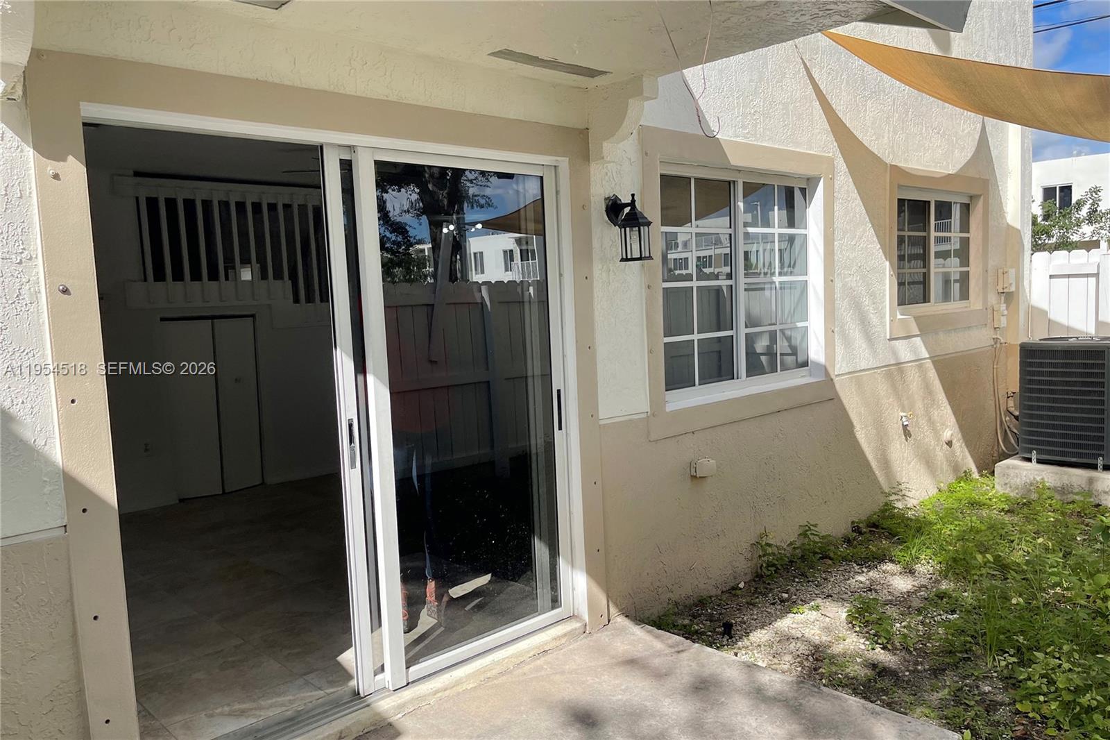 13990 Southwest 260th Street, Unit 13990 Homestead, FL 33032 - Photo 32 of 33 a view of a door of the house