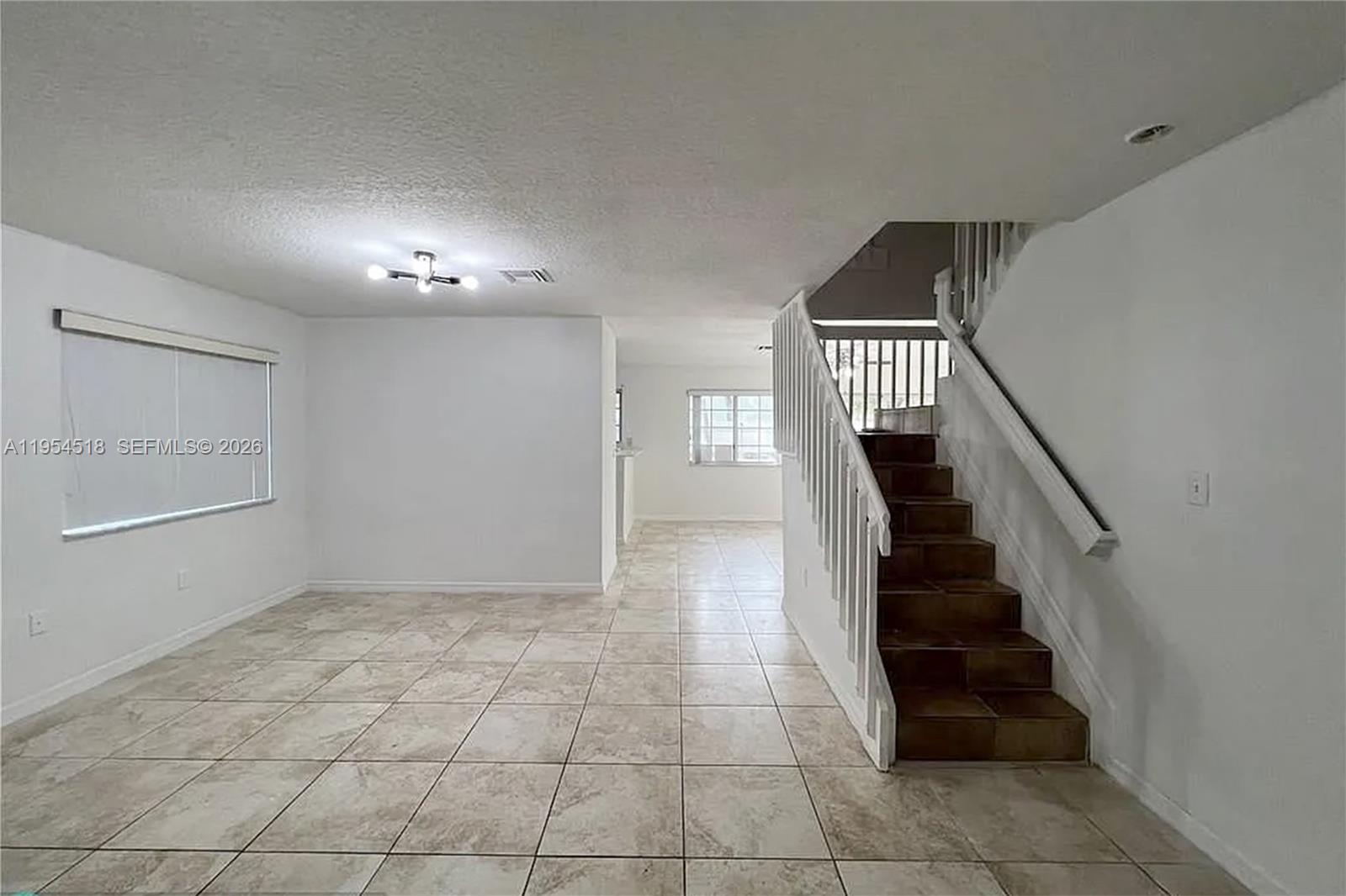 13990 Southwest 260th Street, Unit 13990 Homestead, FL 33032 - Photo 5 of 33 a view of entryway and hall