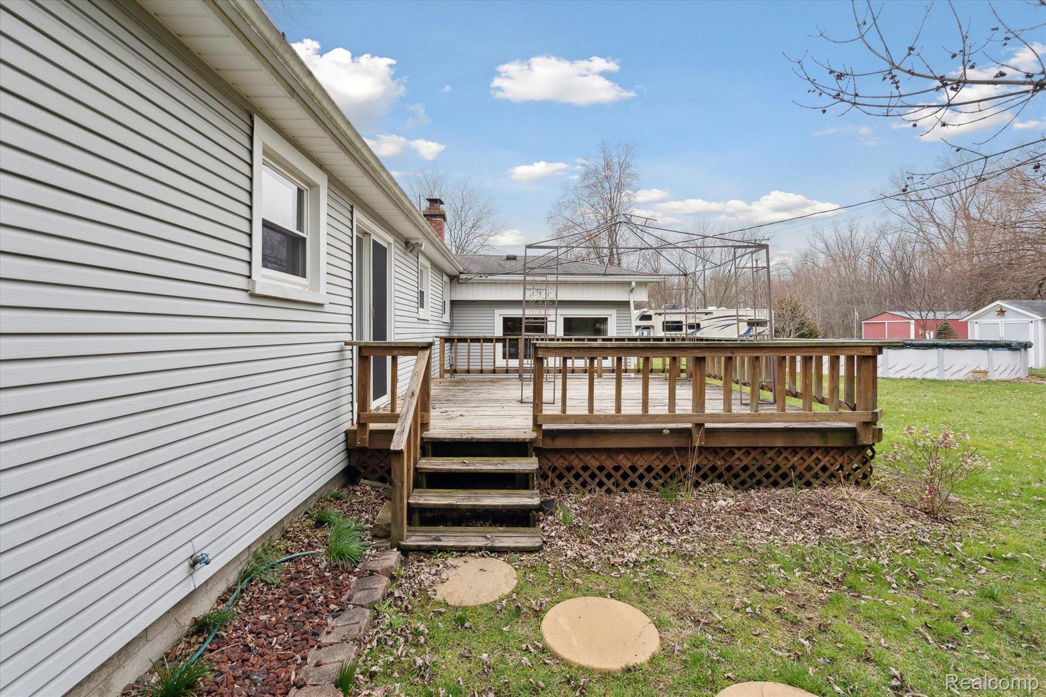 13955 Grafton Road Carleton, MI 48117 - Photo 33 of 55 Deck Leads to Fenced in Backyard Area