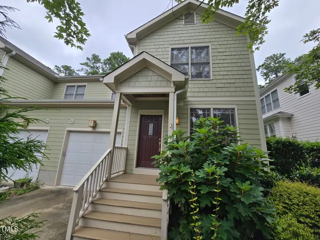a front view of a house with a garage