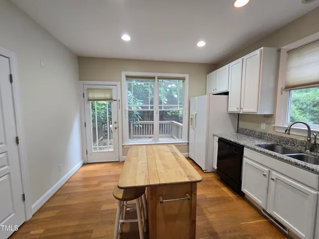 a kitchen with sink and window