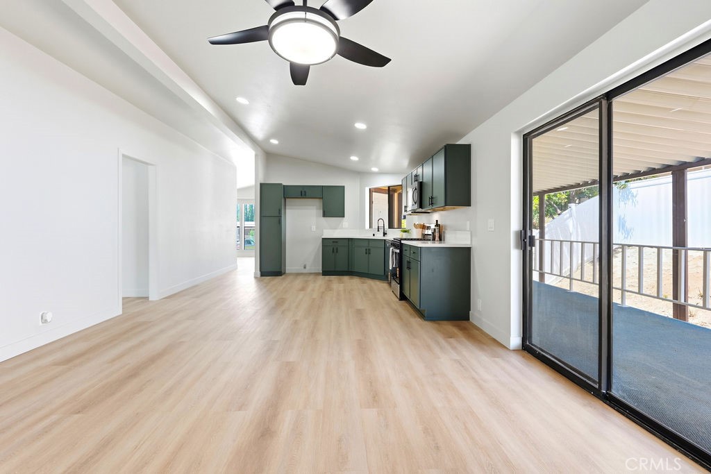 15181 Van Buren, Unit 262 Riverside, CA 92504 - Photo 12 of 48 a kitchen with stainless steel appliances granite countertop a refrigerator and a sink