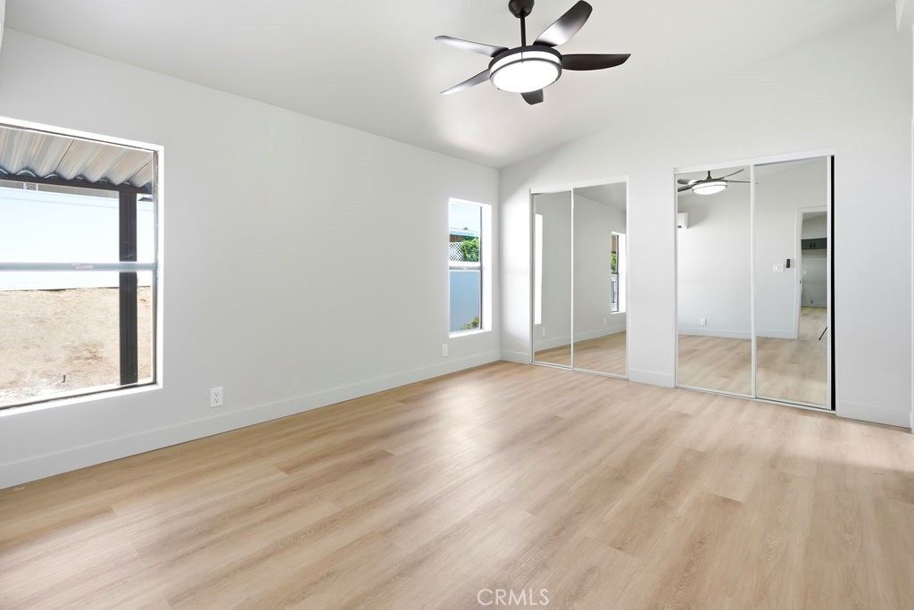 15181 Van Buren, Unit 262 Riverside, CA 92504 - Photo 24 of 48 wooden floor in an empty room with a window