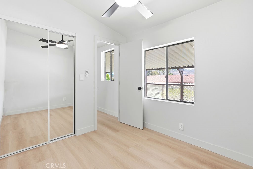 15181 Van Buren, Unit 262 Riverside, CA 92504 - Photo 25 of 48 an empty room with windows and closet
