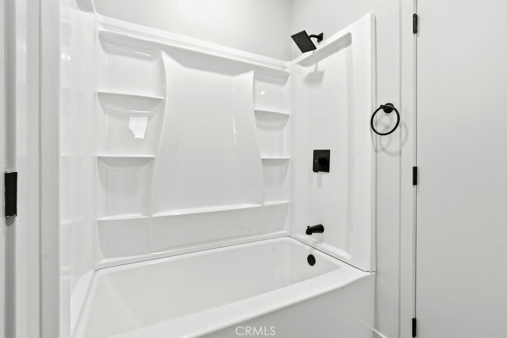 15181 Van Buren, Unit 262 Riverside, CA 92504 - Photo 28 of 48 a bathroom with a bath tub and a shower