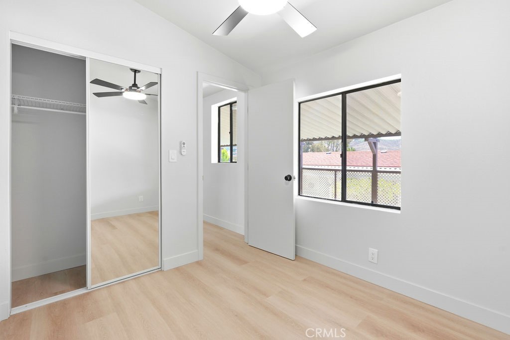 15181 Van Buren, Unit 262 Riverside, CA 92504 - Photo 29 of 48 an empty room with windows and closet