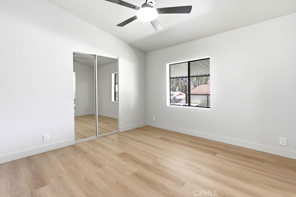 15181 Van Buren, Unit 262 Riverside, CA 92504 - Photo 30 of 48 an empty room with fan and windows