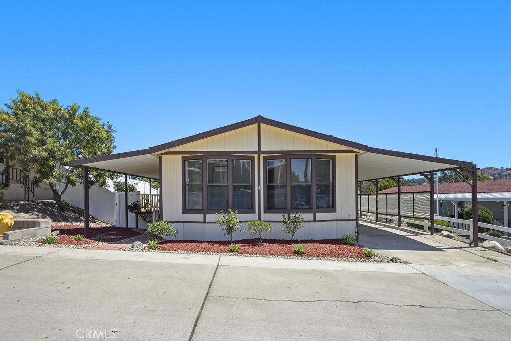 15181 Van Buren, Unit 262 Riverside, CA 92504 - Photo 3 of 48 a front view of a house with basket ball court