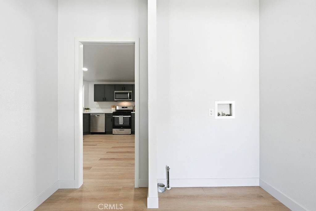 15181 Van Buren, Unit 262 Riverside, CA 92504 - Photo 34 of 48 a view of a kitchen from the hallway