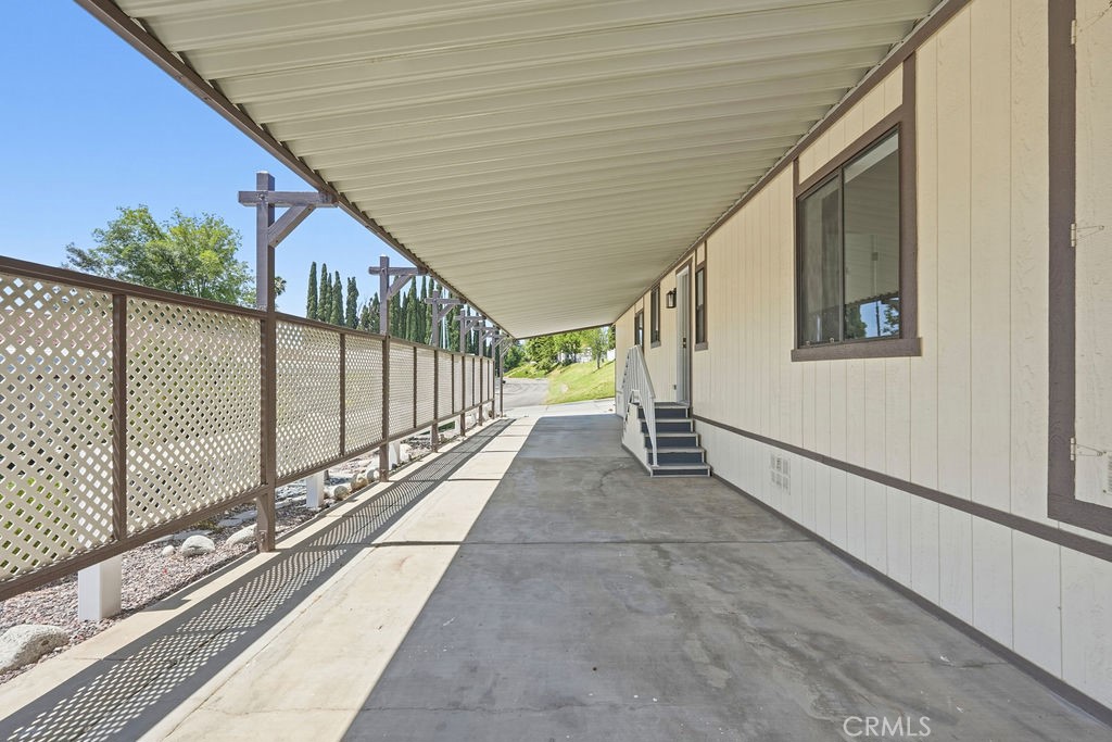 15181 Van Buren, Unit 262 Riverside, CA 92504 - Photo 44 of 48 a view of a balcony with a potted plant