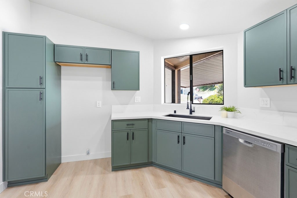 15181 Van Buren, Unit 262 Riverside, CA 92504 - Photo 5 of 48 a kitchen with a sink and cabinets