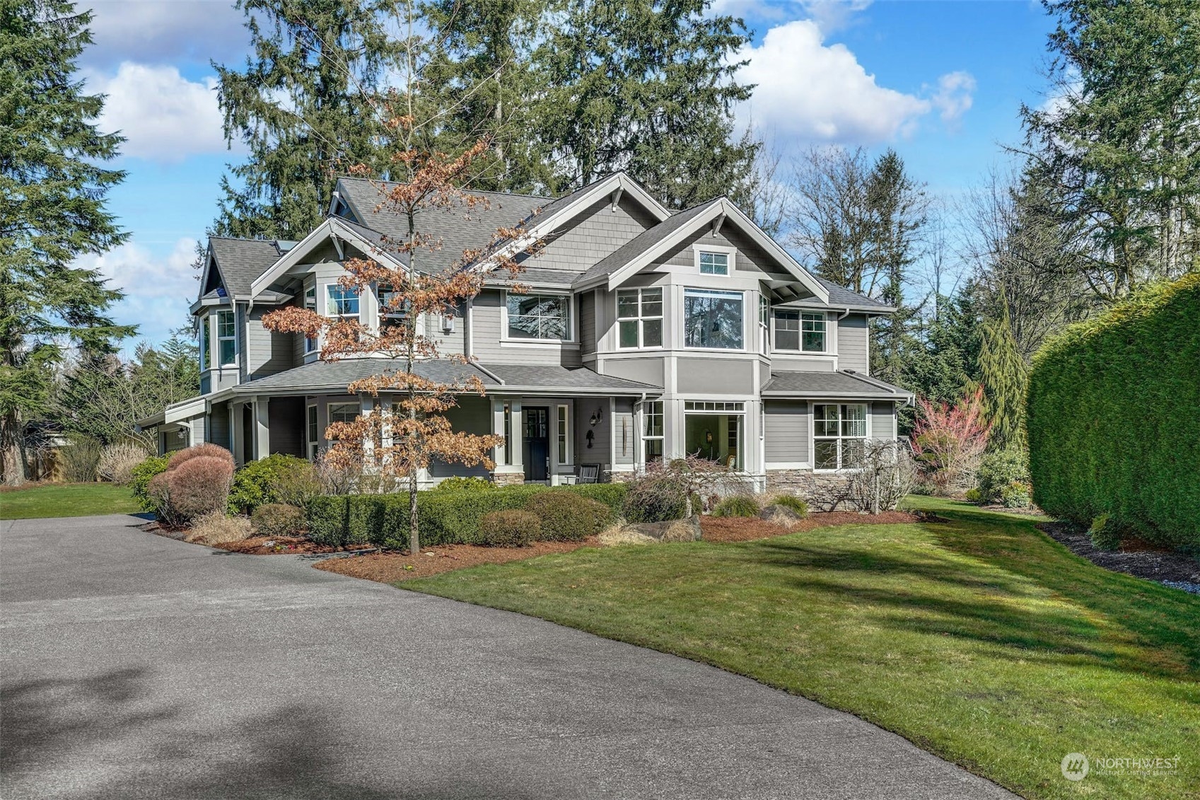 20628 Southeast 162nd Way Renton, WA 98059 - Photo 1 of 25 a front view of a house with a garden