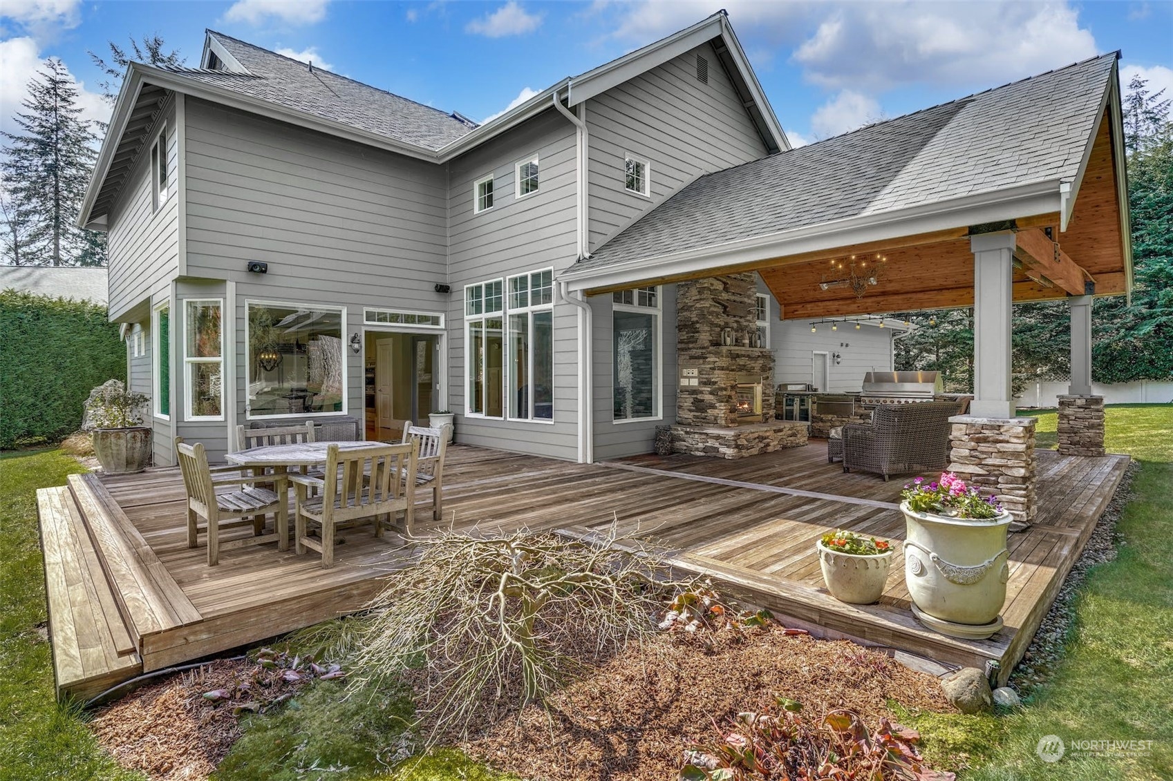 20628 Southeast 162nd Way Renton, WA 98059 - Photo 18 of 25 a view of a patio with table and chairs and potted plants