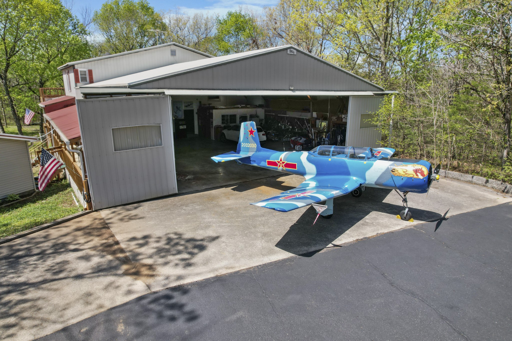 a view of a patio with a table and chairs under an umbrella