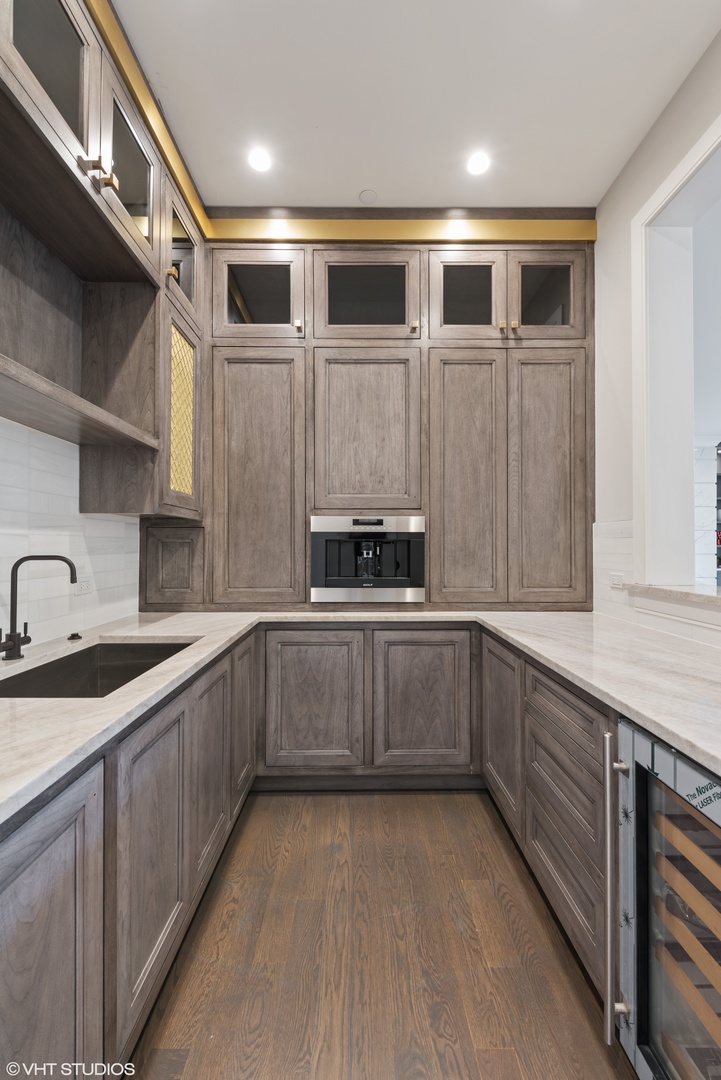 885 Private Road Winnetka, IL 60093 - Photo 11 of 35 a kitchen with a sink and cabinets