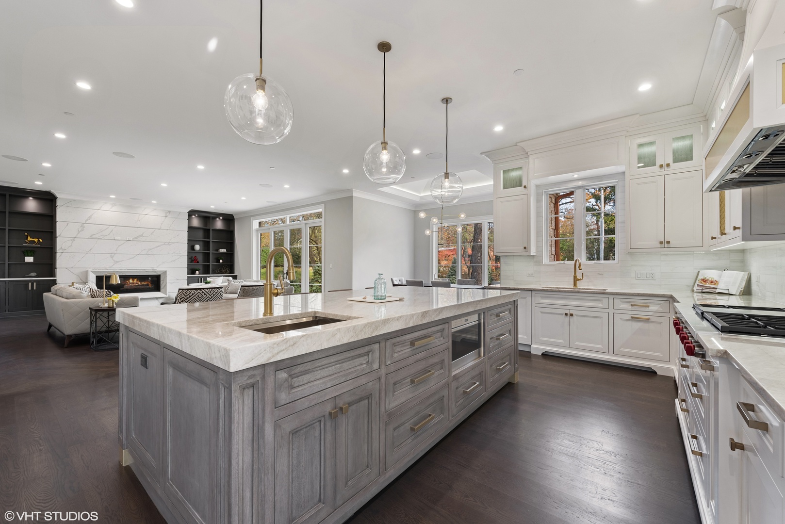 885 Private Road Winnetka, IL 60093 - Photo 10 of 35 a large kitchen with kitchen island a stove a sink a oven and a refrigerator with wooden floor