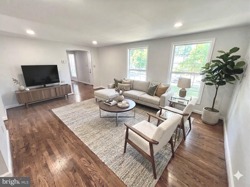 2283 Dosinia Court Reston, VA 20191 - Photo 5 of 28 a living room with furniture a flat screen tv and a large window