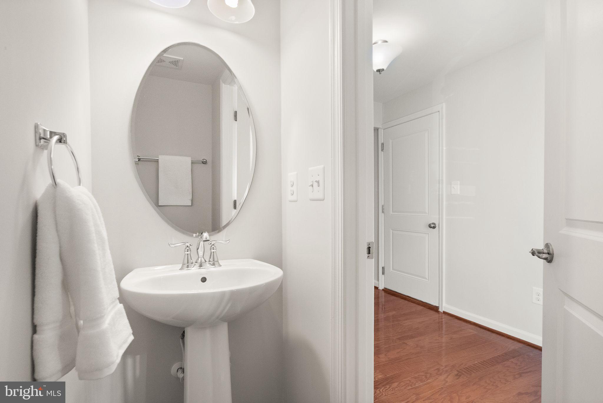 41688 McMonagle Square Aldie, VA 20105 - Photo 11 of 59 a bathroom with a sink and a mirror