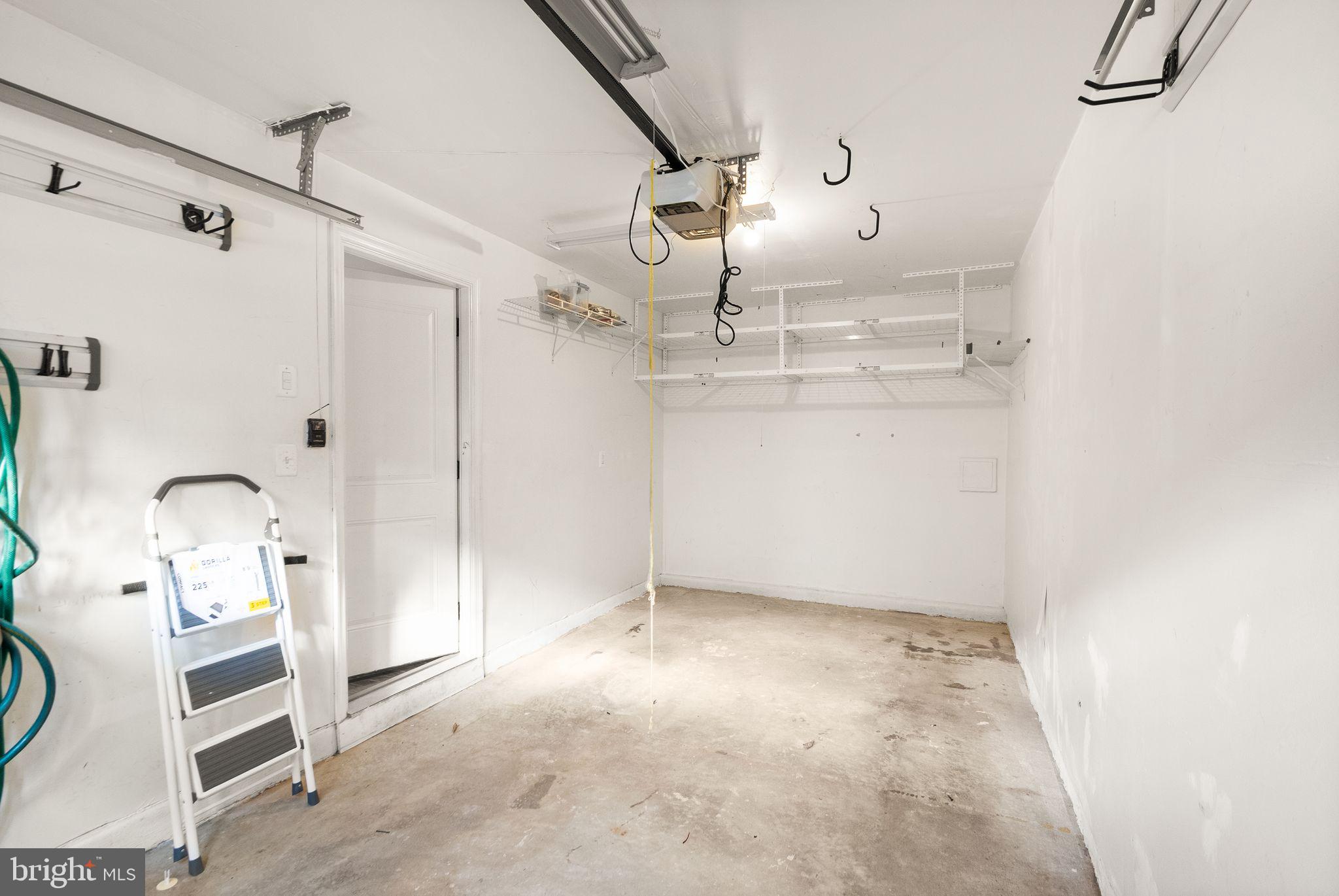 41688 McMonagle Square Aldie, VA 20105 - Photo 17 of 59 a view of a storage & utility room with racks on the wall